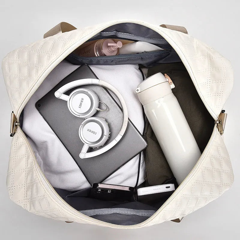 Large black Oxford cloth travel bag with a breathable lining, showing 36-55 litre capacity.
