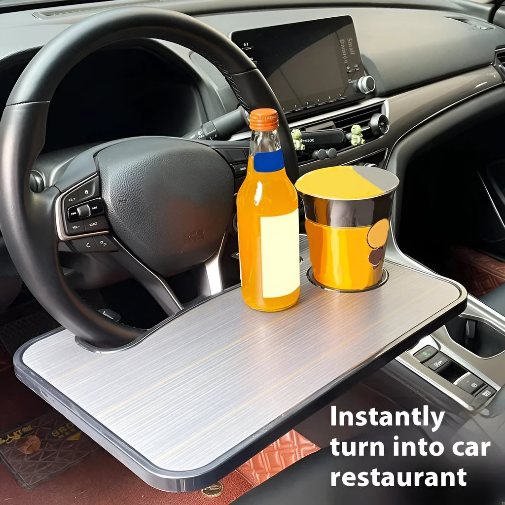 Large black portable car tray with foldable cup holder placed over a steering wheel