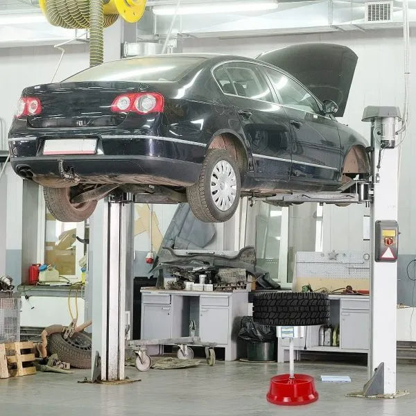 Portable hub balancer with aluminium head for car wheels showing bull's eye level and enamel-finished base