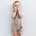 Children's khaki cotton overalls shorts with bow detail and straps, front view