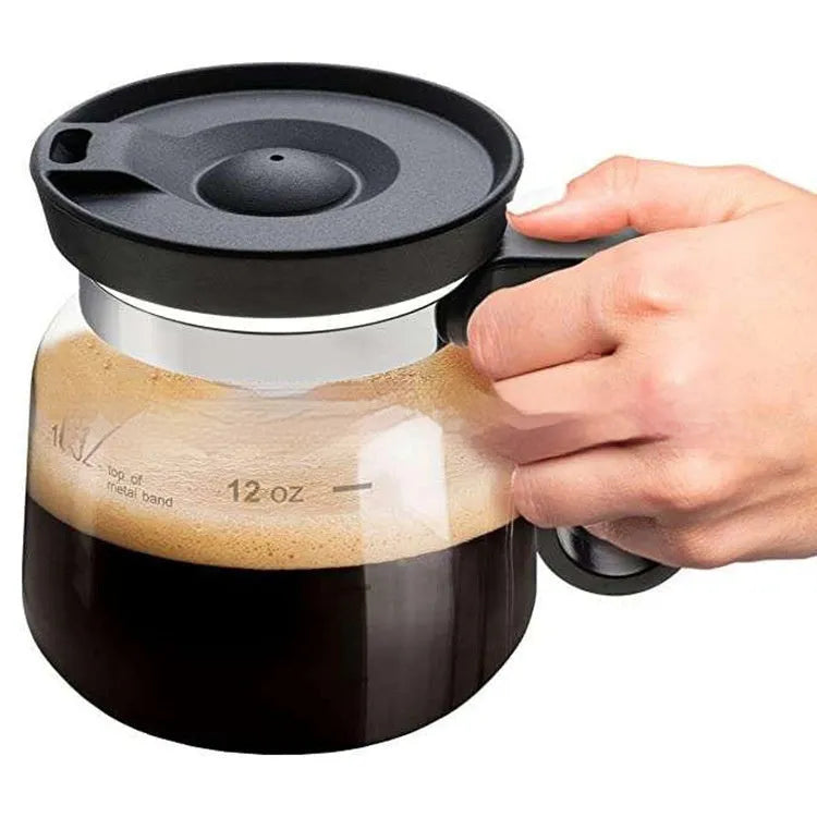 Transparent borosilicate glass stovetop coffee maker with grey silicone cover