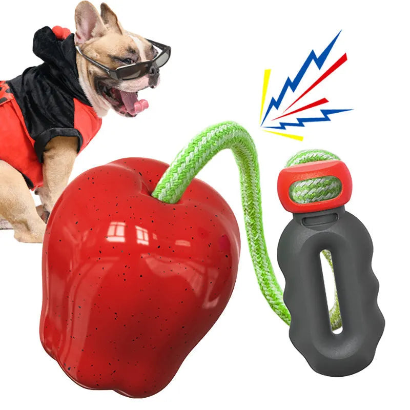 Green plastic dog molar toy with a built-in food-dropping ball on a white background.
