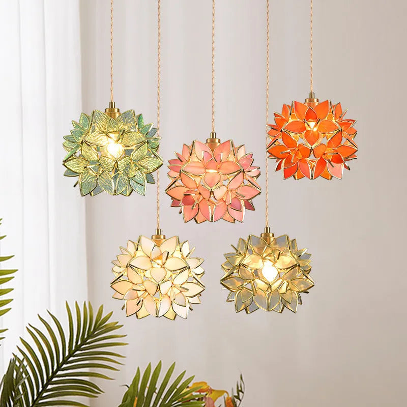 Stained glass line chandelier hanging from ceiling with colourful glass shades and copper lamp head