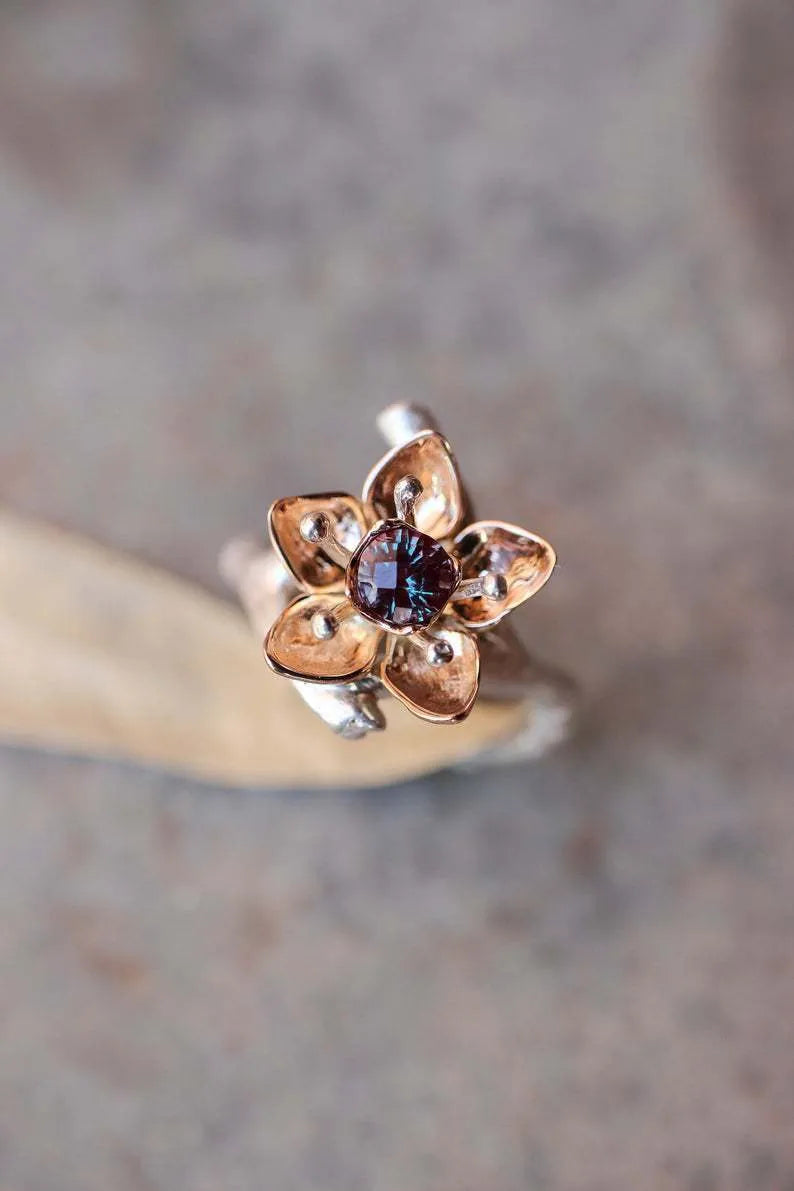Silver two-tone floral geometric pattern alloy ring for women on a white background.