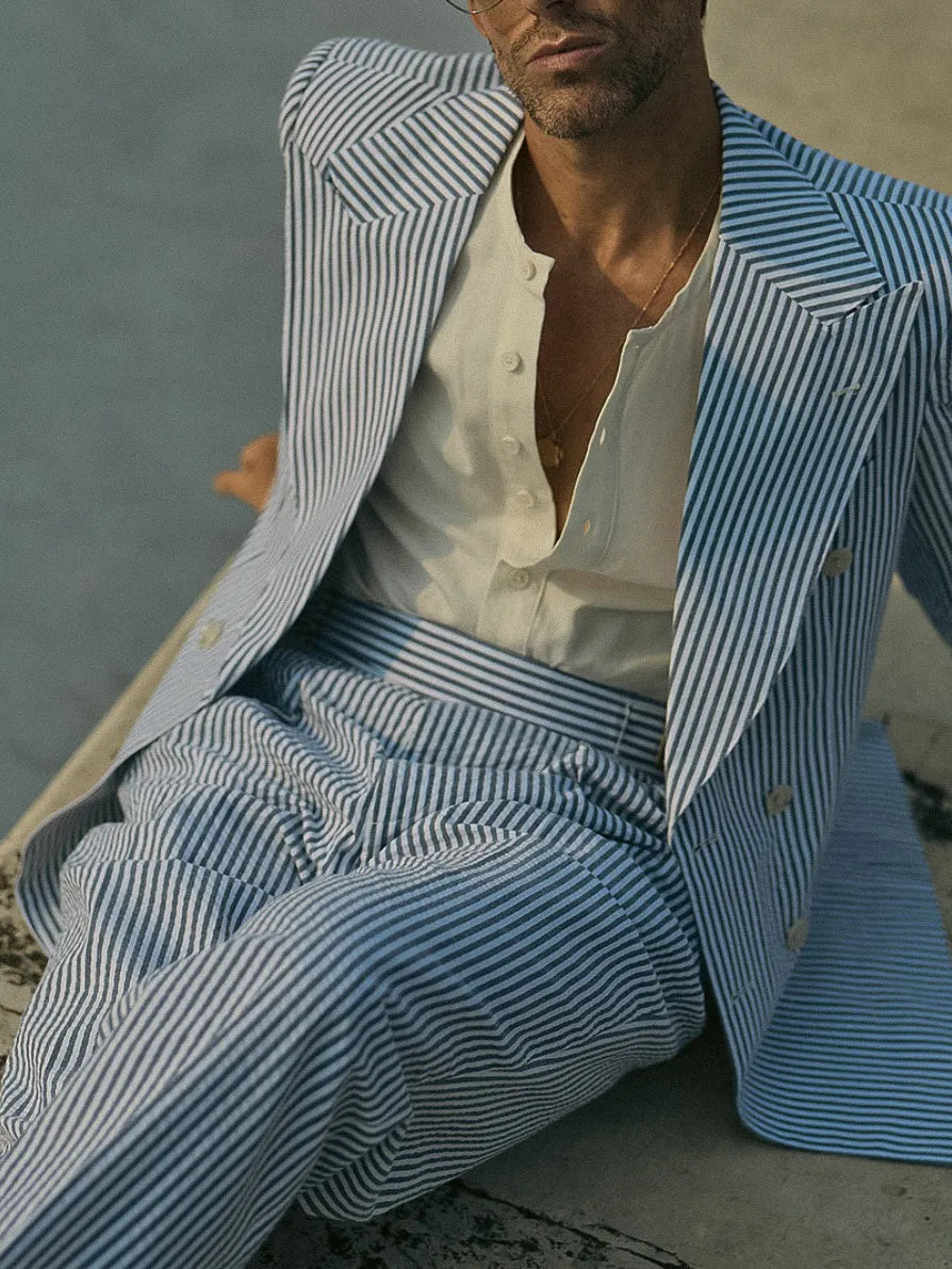 Blue and white striped polyester suit set with blazer and trousers on mannequin