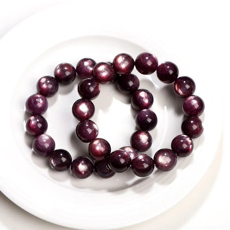 Natural purple lepidolite crystal bracelet with round polished beads in geometric arrangement