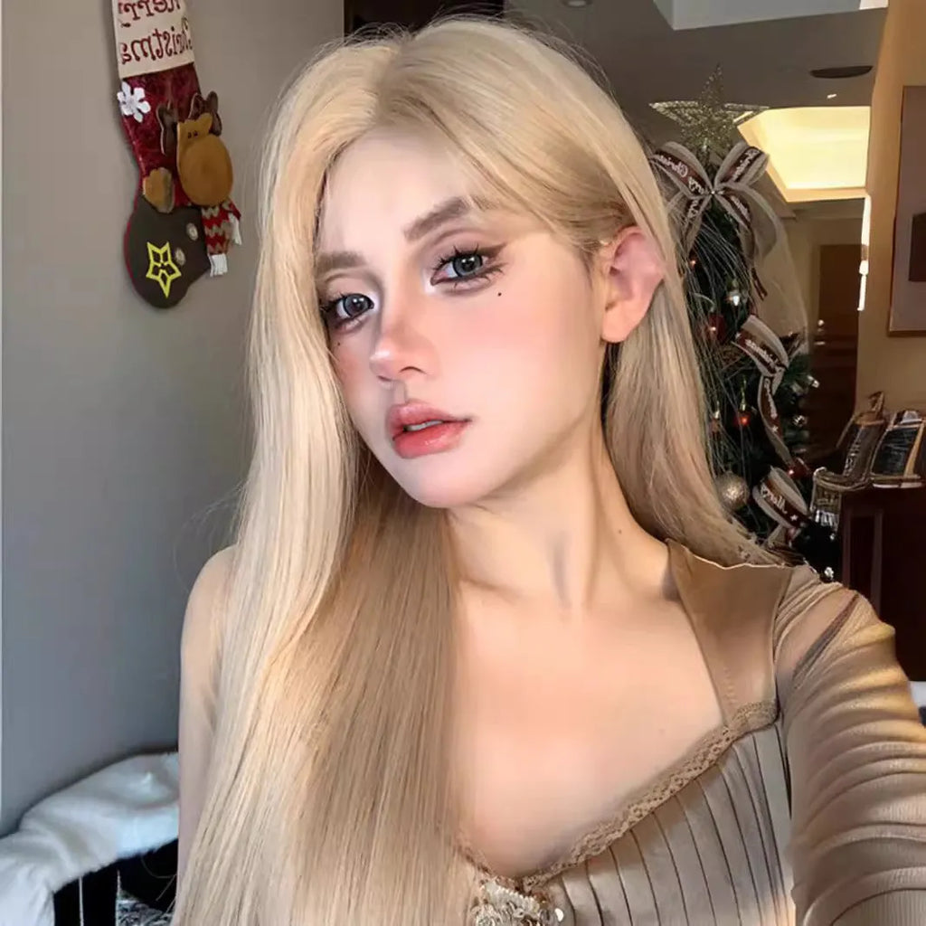 Women's long straight milk tea blonde wig on a stand with hair net.