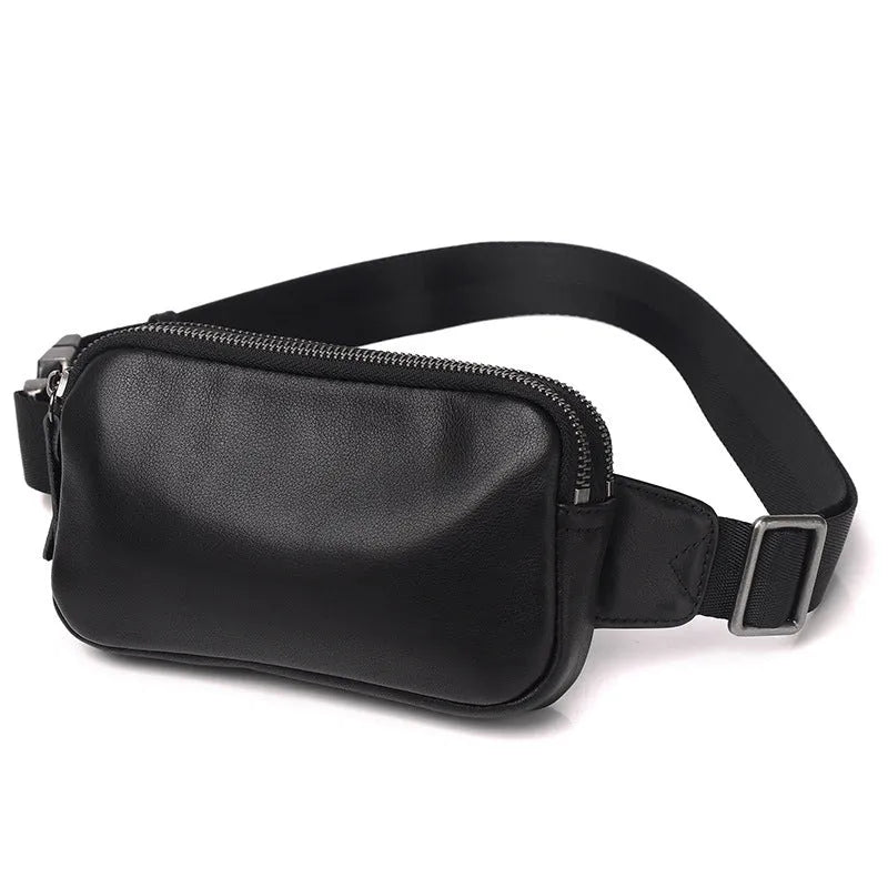Men's small black leather crossbody bag showing compact size and crossbody strap.