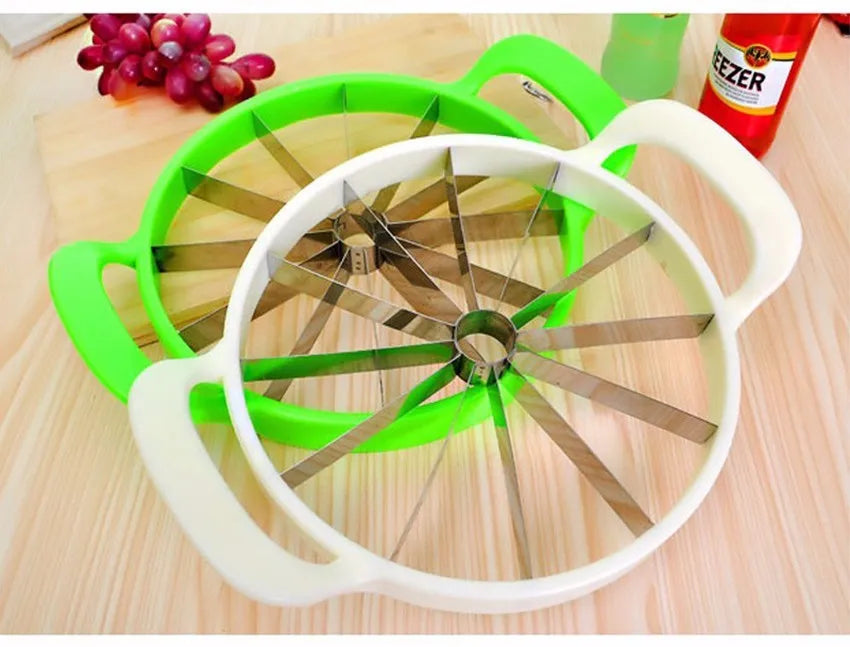 Green plastic melon slicer with stainless steel blades cutting a watermelon into wedges.