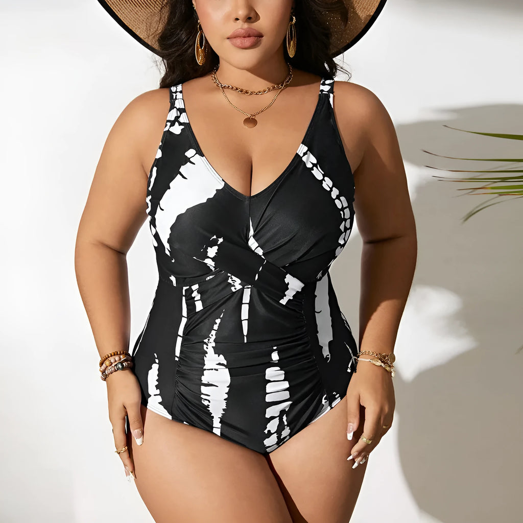 Black conservative one-piece swimsuit on a mannequin, showing sleeveless design and Siamese colour matching pattern.