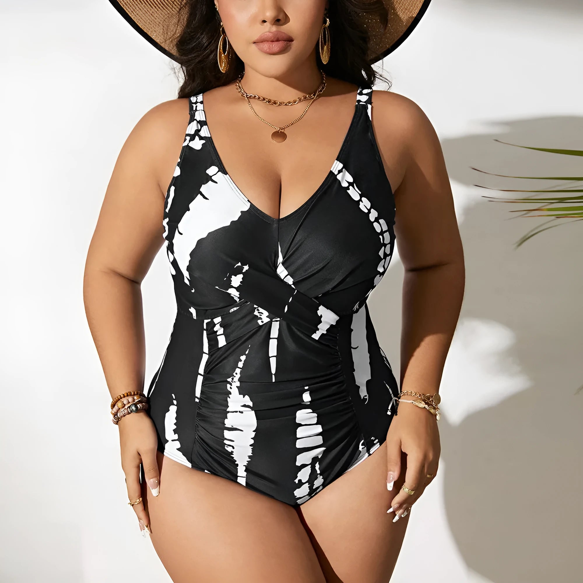 Black conservative one-piece swimsuit on a mannequin, showing sleeveless design and Siamese colour matching pattern.
