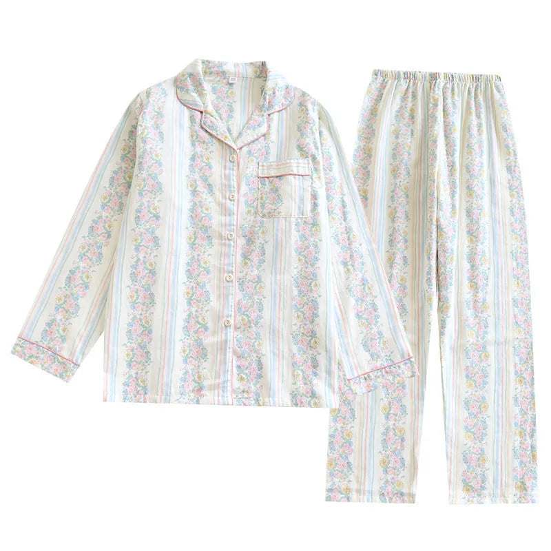 Women's red fruit print cotton gauze long-sleeved top and trousers two-piece lounge set laid flat.