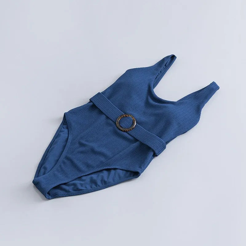 Navy blue women's one-piece swimsuit with triangle slimming design and removable chest pads