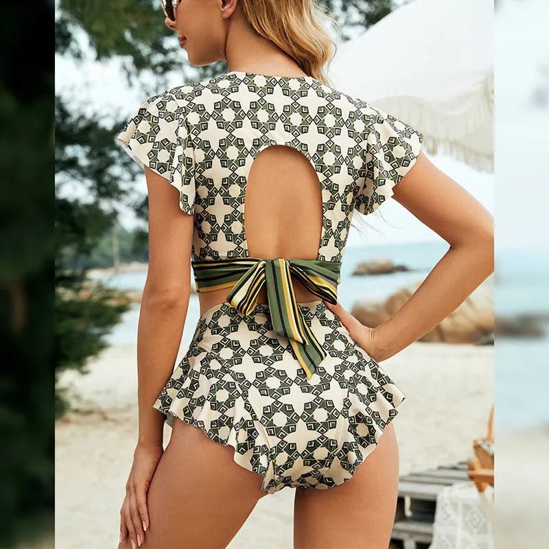 Green two-piece bikini swimsuit with backless lace-up V-neck top and matching shorts