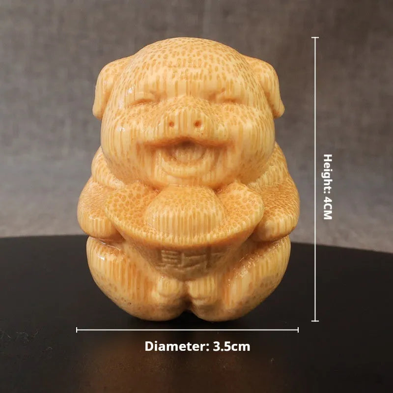 Solid bamboo pig carving ornament measuring 4cm height with 3.5cm diameter ingot shape