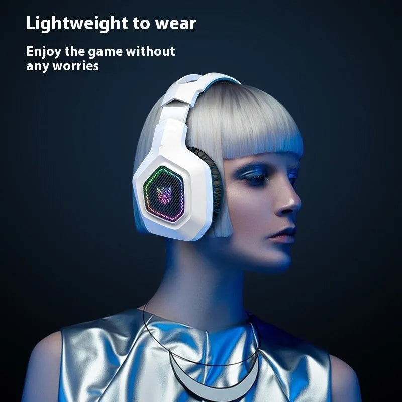 Black and white wireless gaming headset with RGB lighting showing 2.4G receiver and charging cable