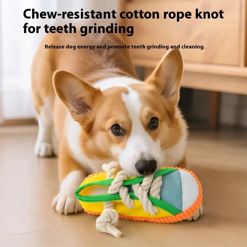 Yellow plastic dog slipper toy with a squeaker for chewing.