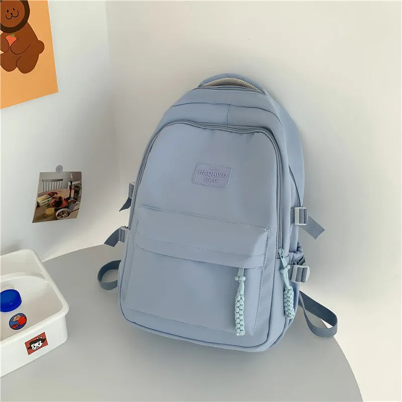 Korean-style lightweight waterproof nylon backpack for primary school students in macaron colour with curved shoulder strap, 20-35L capacity