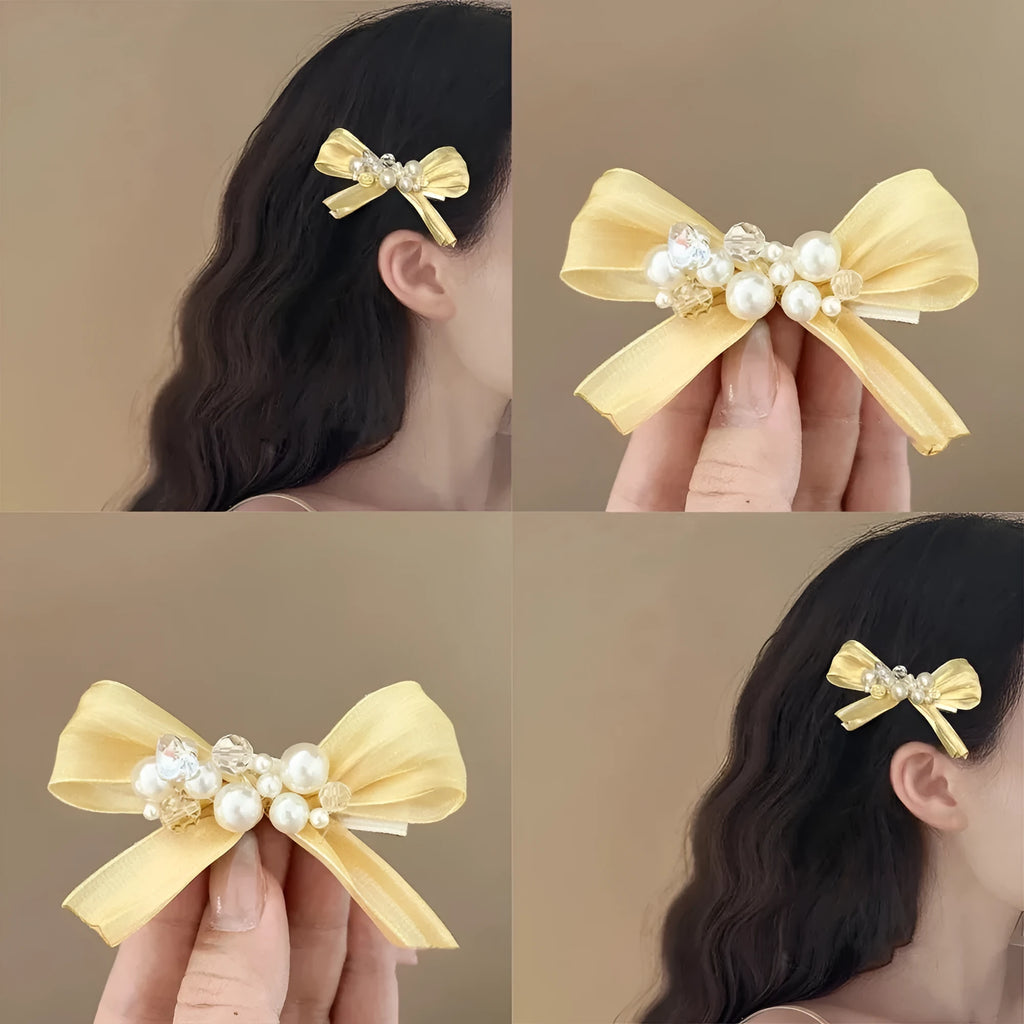 Yellow cloth bow barrette hair clip with rhinestone and pearl details on duckbill clip
