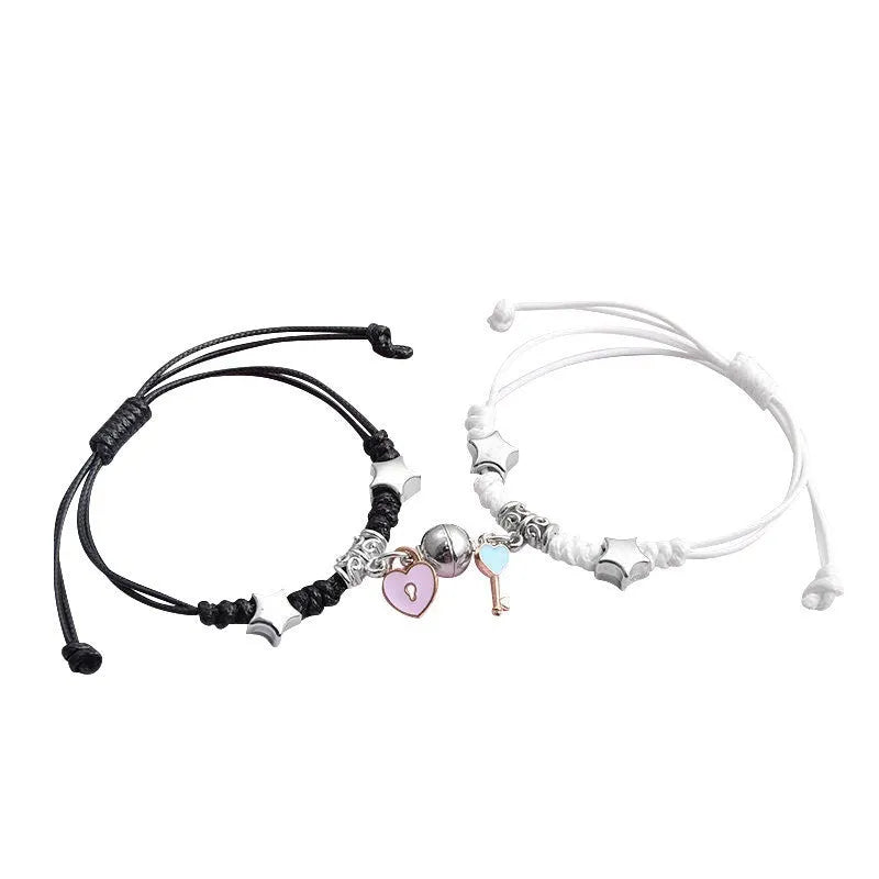Magnetic couple's alloy bracelet pair with electroplated finish in various designs like crown, cross, and kitten.