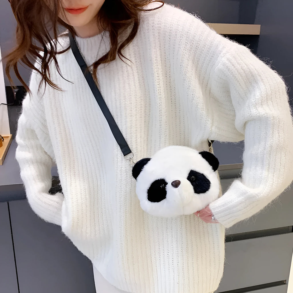 Soft plush panda head crossbody bag with cylindrical shape and sandwich pocket.