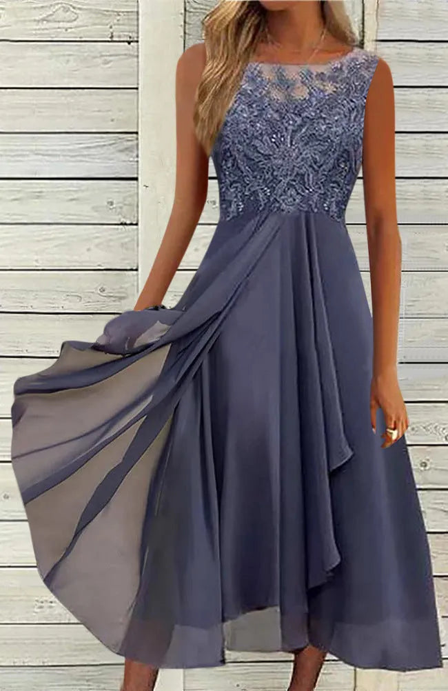 Women's sleeveless green chiffon dress with lace hollow-out detailing on a mannequin.