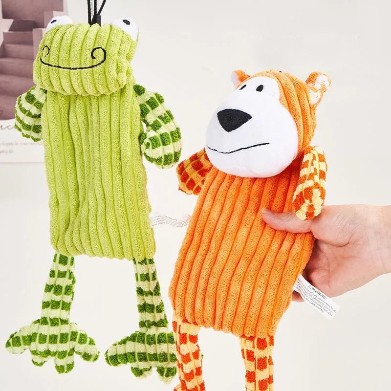 Green and orange plush dog toy with immortal squeaker for aggressive chewers