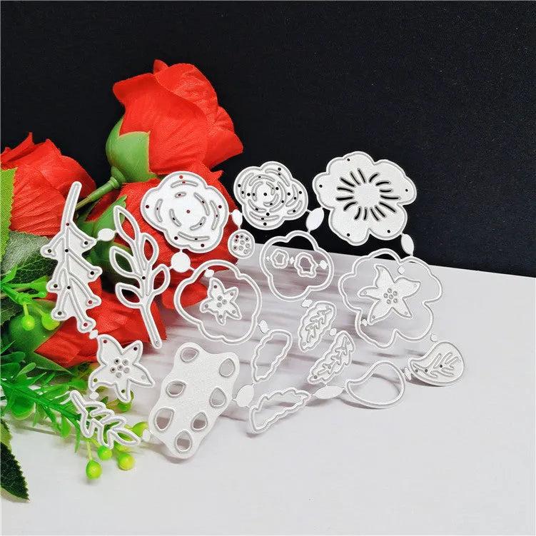 Silver carbon steel flower knife mould for paper cutting measuring 14.3cm by 9.9cm with etched botanical design