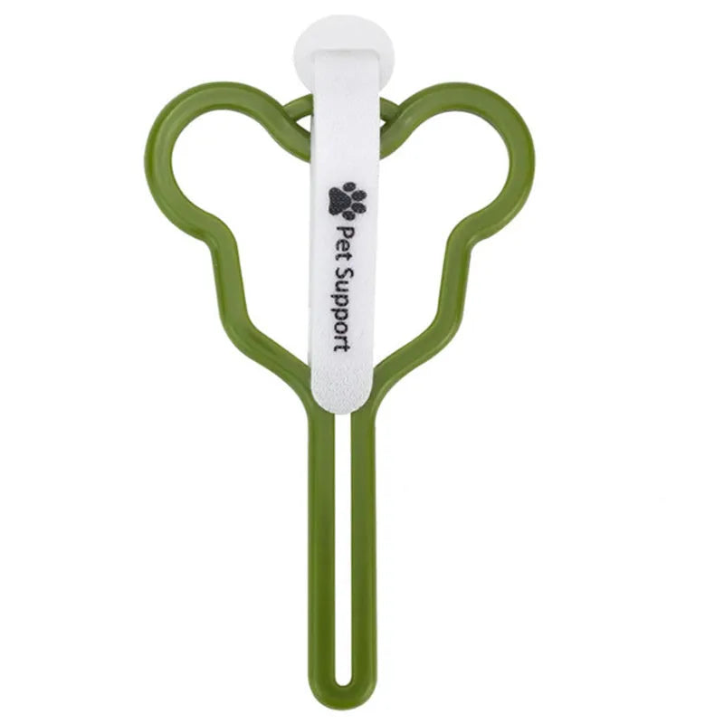 A coloured dog poop bag holder with a Velcro strap attached to a dog lead.