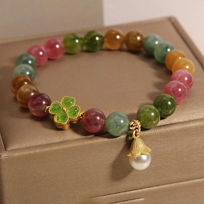 Women's tourmaline bracelet with four-leaf clover pearl pendant and geometric drop-shaped elements
