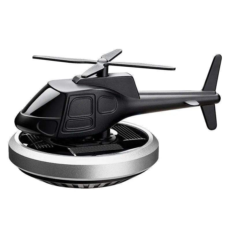 Silver metal solar-powered helicopter car ornament with rotating perfume diffuser blades.