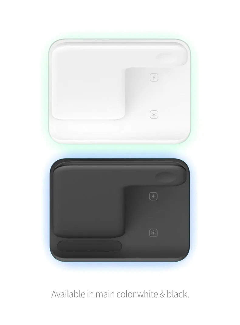 White three-in-one wireless charging stand for phone, watch, and headset on a desk.