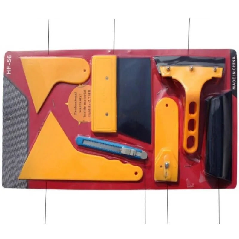 Seven-piece car foil tool set including scrapers, knives, tendon scraper, and pressing block on a table.