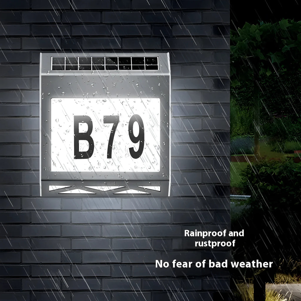 Solar-powered outdoor doorplate light with digital display showing house numbers