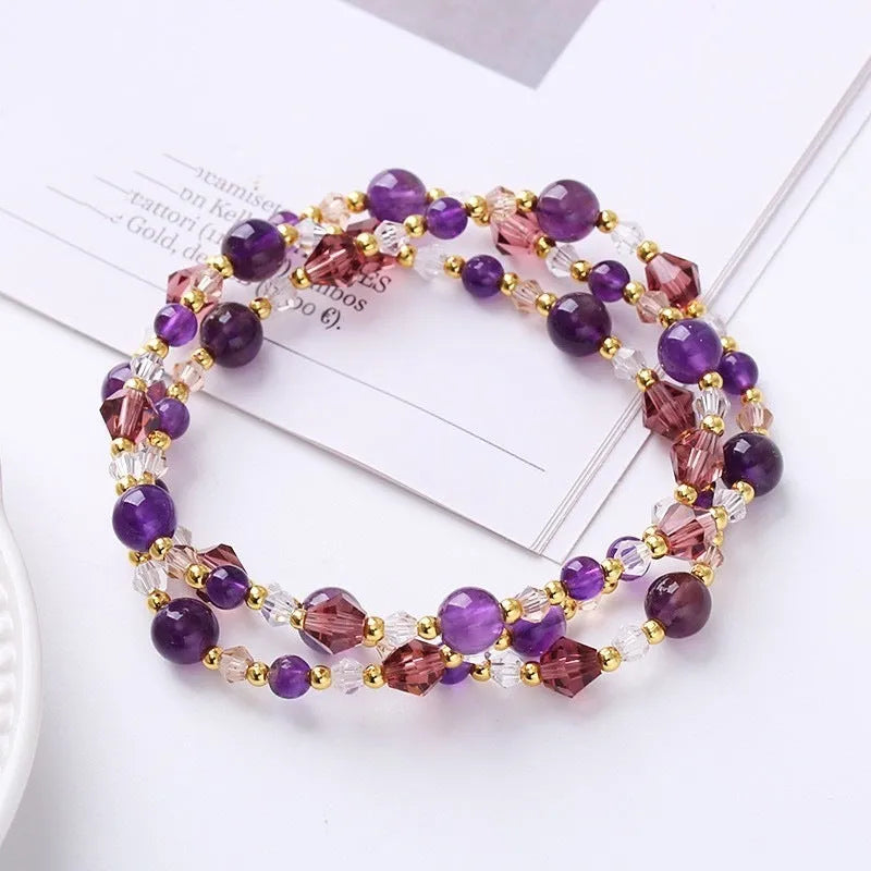 Women's adjustable three-ring bracelet with tourmaline, strawberry quartz and amethyst crystals on cord