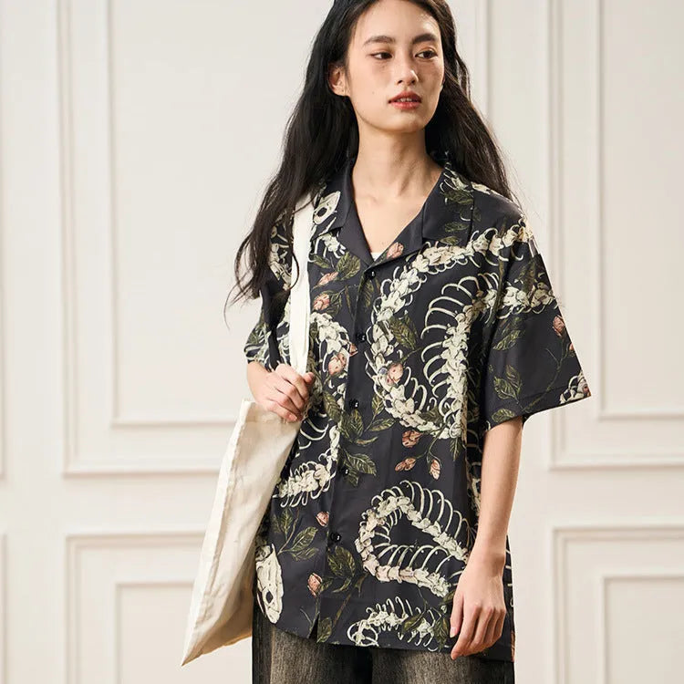 Short sleeve Cuban collar shirt with a snake bone and floral printed pattern in a loose fit.