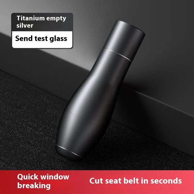 Aluminium alloy vehicle emergency window breaker tool with test glass on a table.