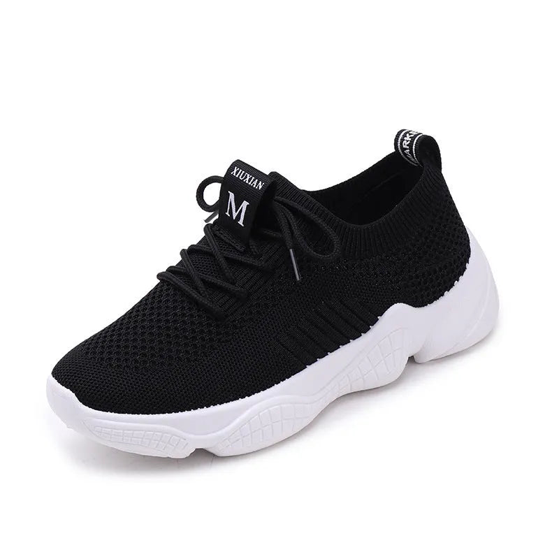 White women's thick-soled casual trainers with woven upper and front strap closure