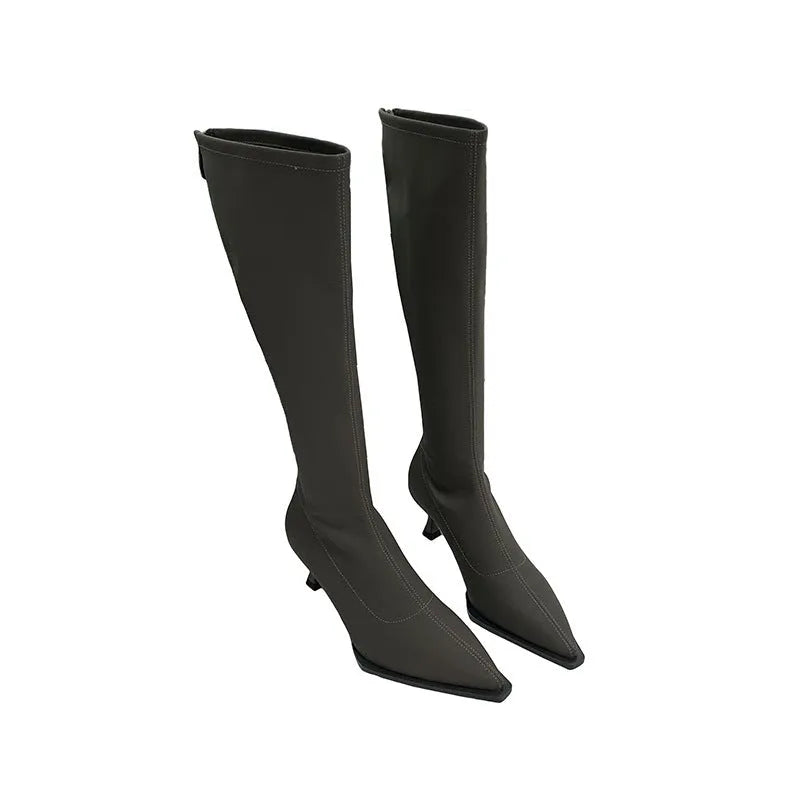 Black women's pointed toe below knee boots with a stiletto heel and a back zip.