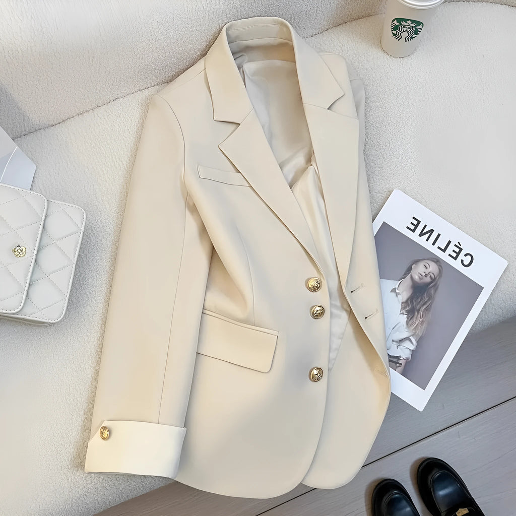 Korean style loose fit women's coat in beige and black with long sleeves and pockets.
