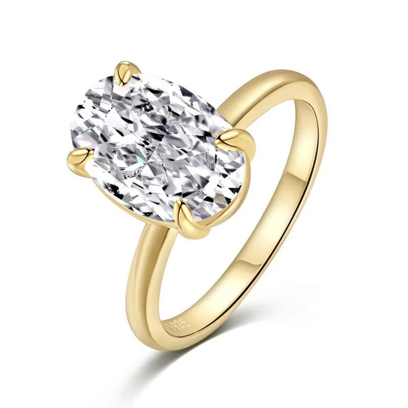 Oval gemstone ring in a four-claw setting on a silver band.