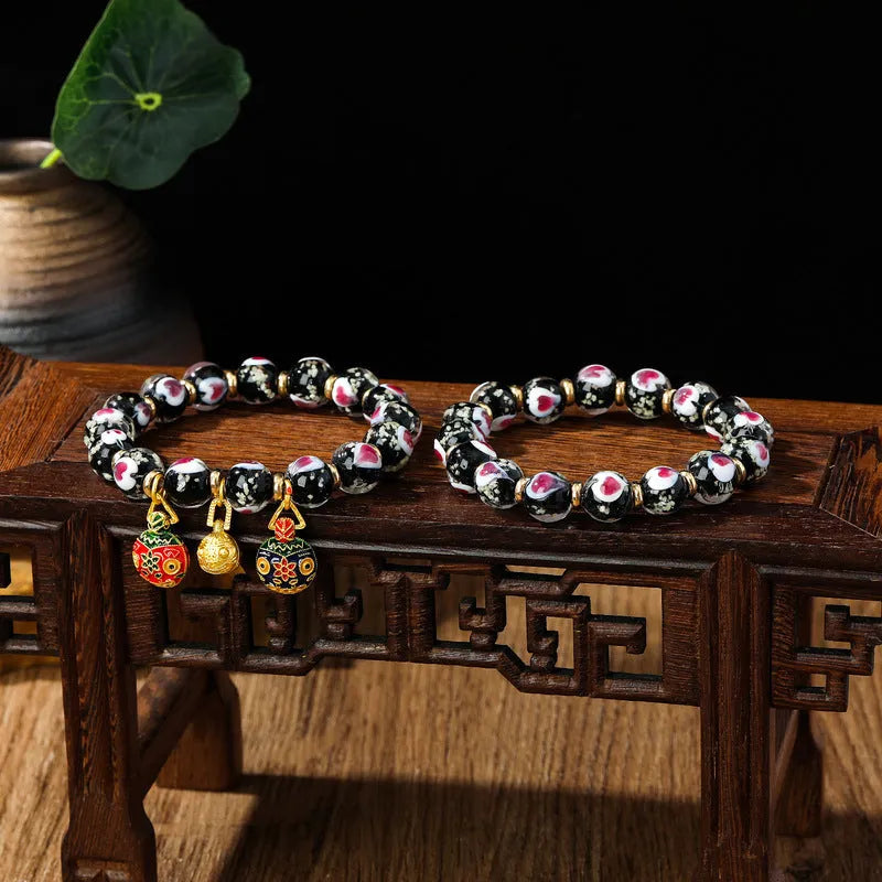Handmade fluorescent glaze bracelet with swallowing gold beast motif on heart-shaped 10mm beads