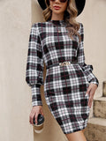 Black tight-fitting midi dress with voluminous lantern sleeves and leather stitching detail.