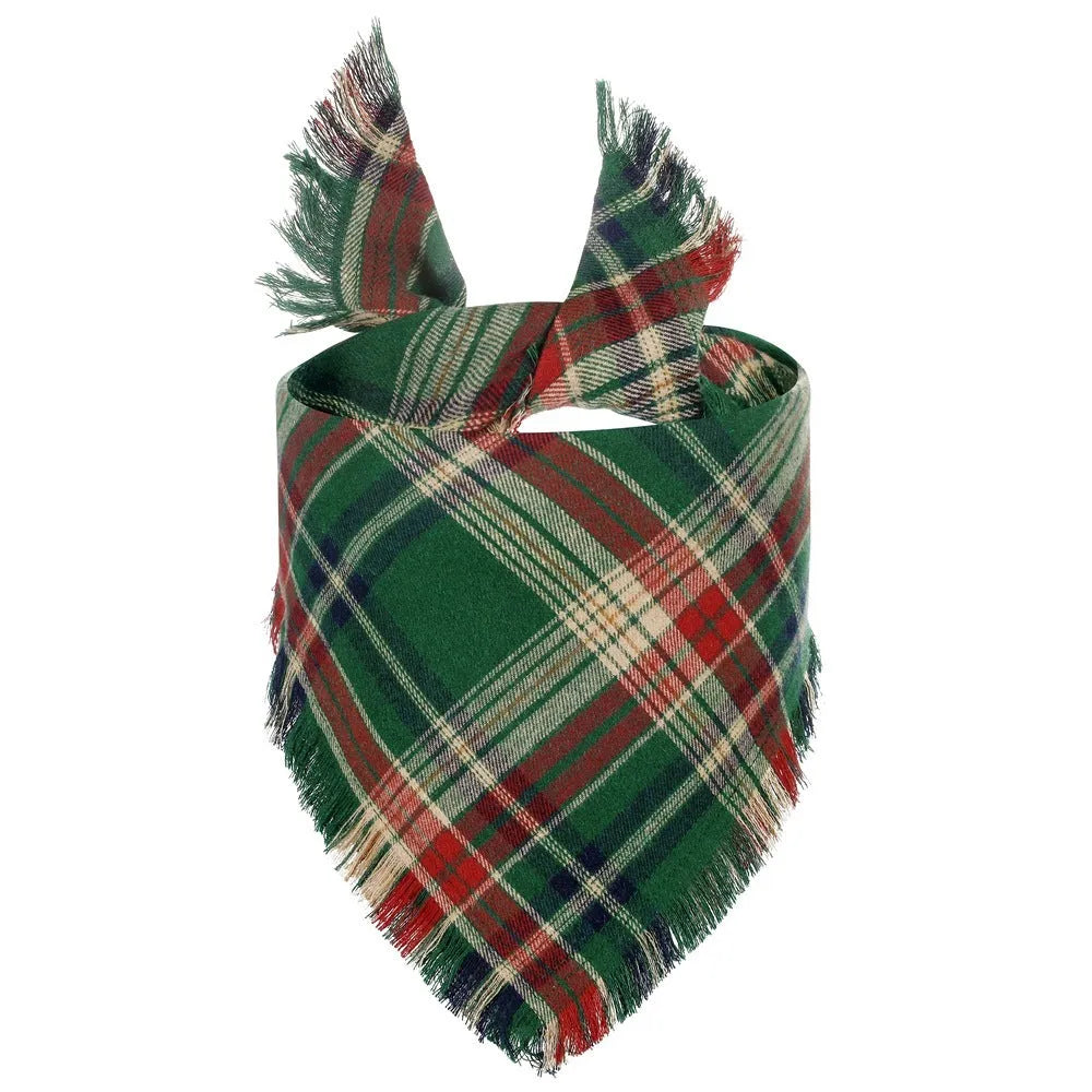 Plaid triangle dog bandana with tassels in autumn colours on a dog's neck.