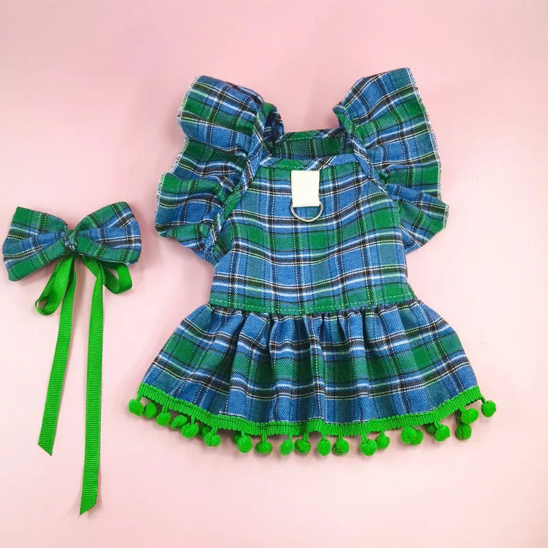 Pet wearing Christmas tartan plaid skirt with matching head flower and bow tie festive costume