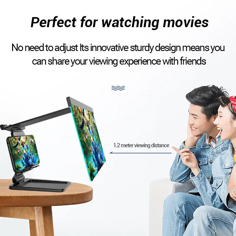 Black folding mobile phone screen amplifier with detachable holder on a desktop.