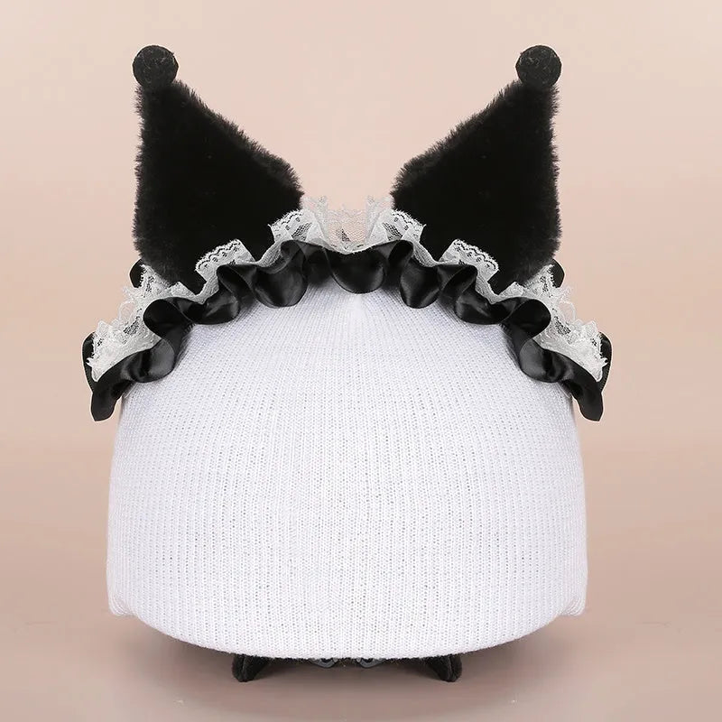 Plush cartoon-themed cover set on a medium motorcycle helmet with soft ear decorations.
