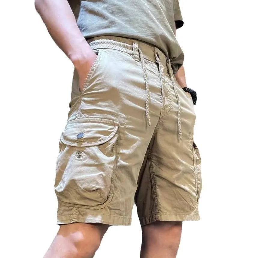 Loose-fit Korean style casual overalls trousers with multiple pockets, shown in khaki colour.