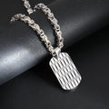 Men's titanium steel necklace with geometric water ripple pendant on an emperor chain.