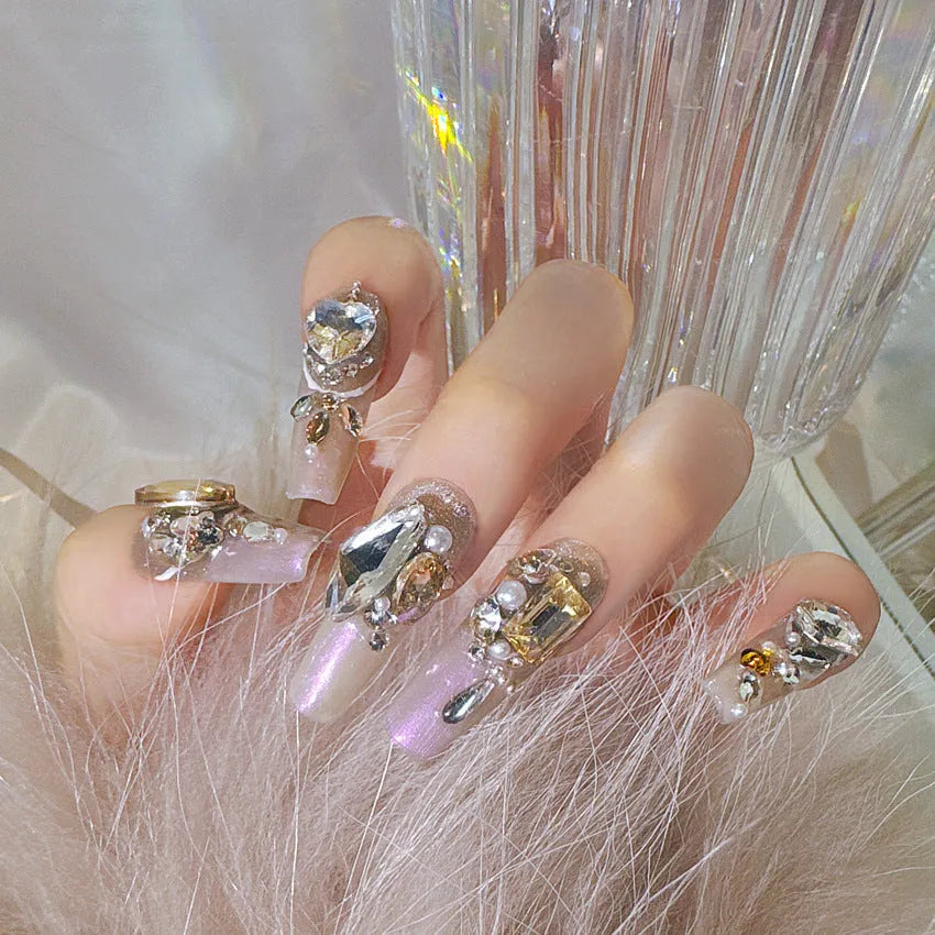 Rhinestone embellished false nail patches in heavy industry luxury designs with card packaging
